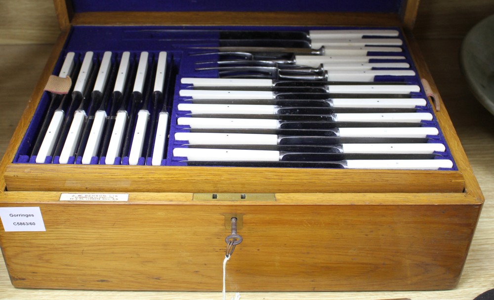 A W H Benson canteen of plated Old English pattern flatware for twelve people, in three tier golden oak case, with ivory handled knives